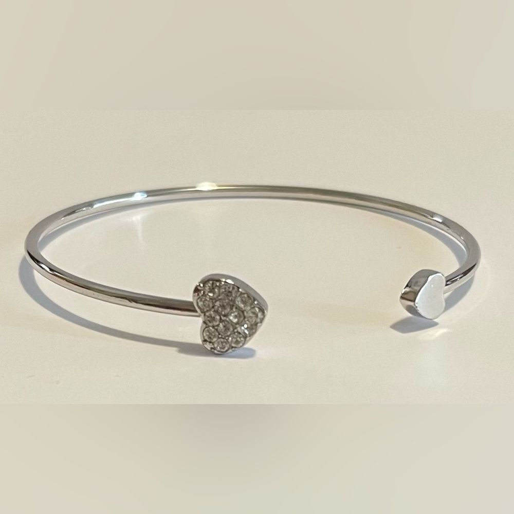 Silver double heart bangle.